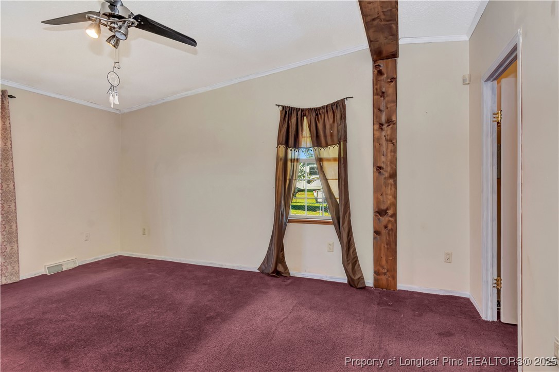 2589 Pleasant Hope Road Fairmont, NC 28340 - Photo 19 of 36 an empty room with windows and closet