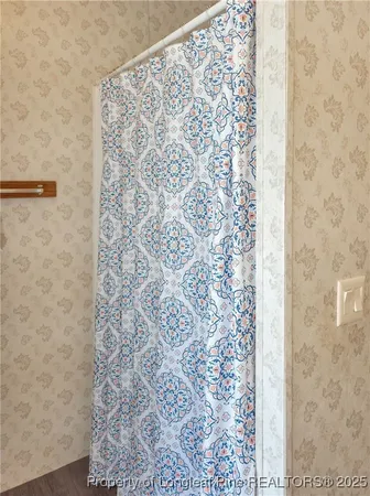 a bathroom with a shower curtain