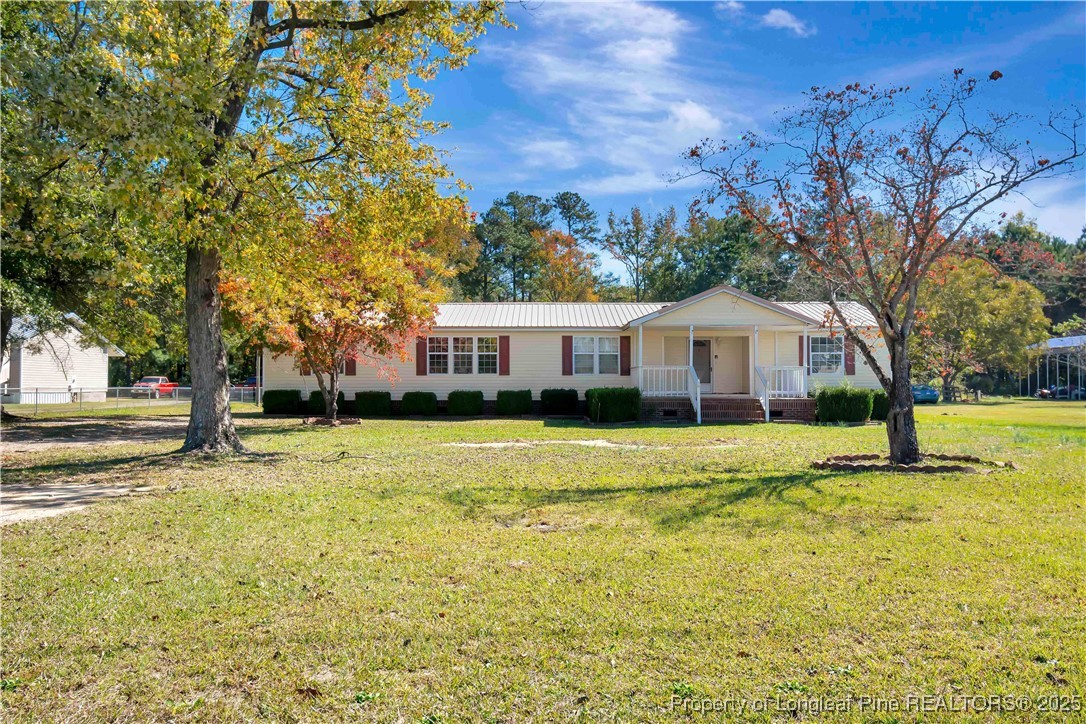 2589 Pleasant Hope Road Fairmont, NC 28340 - Photo 3 of 36 a front view of house with yard and swimming pool