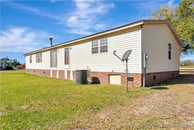 a view of a swimming pool and trees in the background