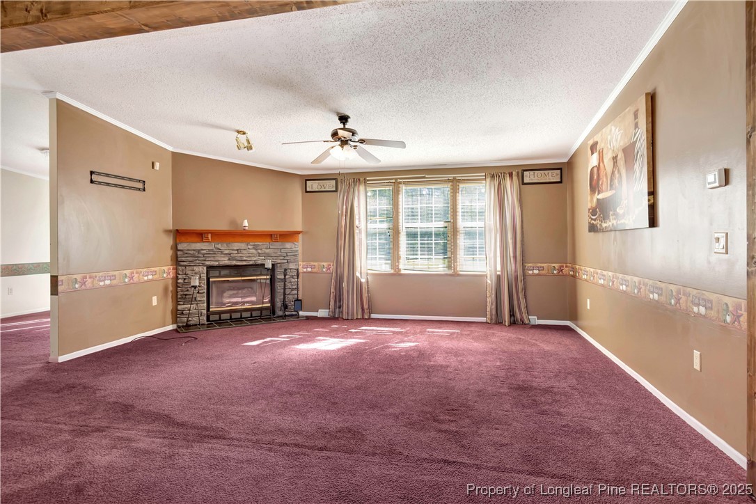 2589 Pleasant Hope Road Fairmont, NC 28340 - Photo 7 of 36 a view of an empty room with a fireplace and a window
