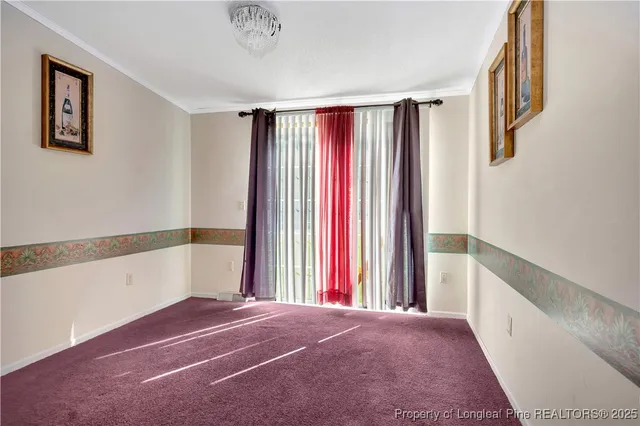 a view of a big room with windows and closet