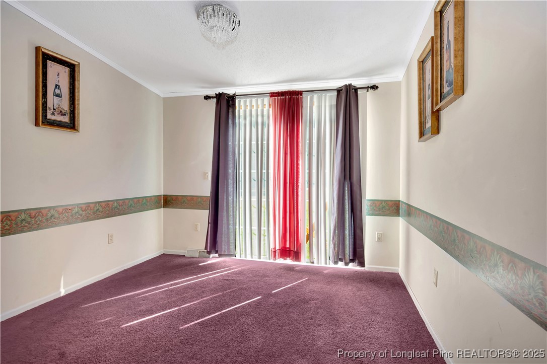 2589 Pleasant Hope Road Fairmont, NC 28340 - Photo 9 of 36 a view of a big room with windows and closet