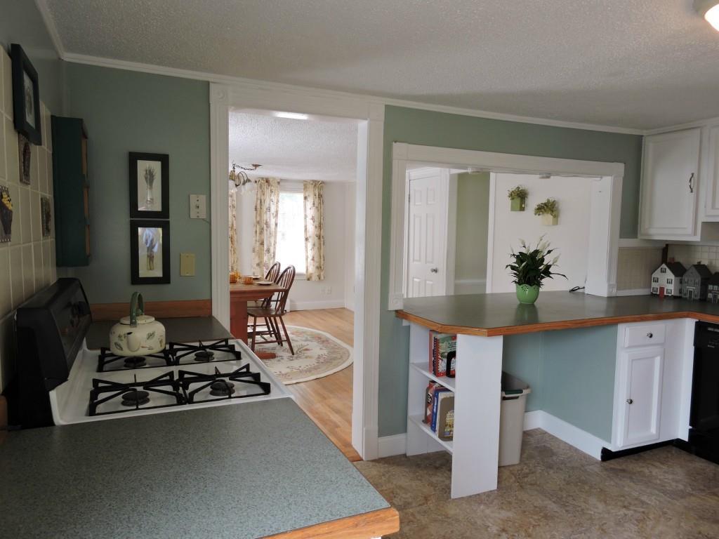 885 Chadbourne Road Standish, ME 04084 - Photo 9 of 35 Open concept kitchen to dining room...