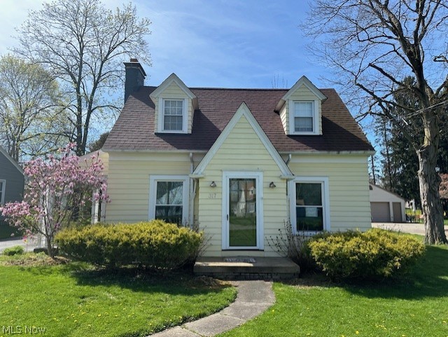 317 Ewing Road Youngstown, OH 44512 - Photo 2 of 15 Cape cod-style house with a front yard