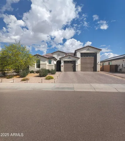 a view of building with car parked