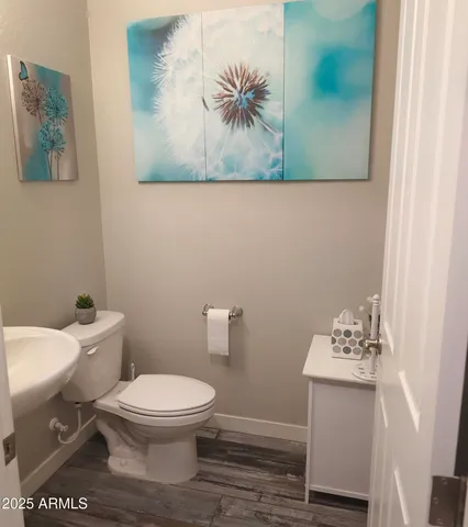a bathroom with a toilet and a sink