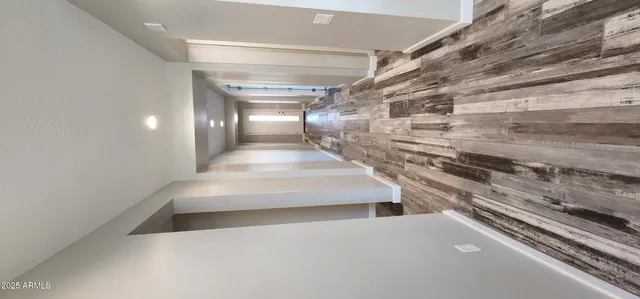 a kitchen with kitchen island a counter space a sink a stove and wooden floor