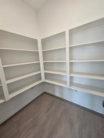 a view of a livingroom with furniture and a window