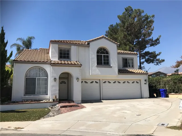 a front view of a house with yard