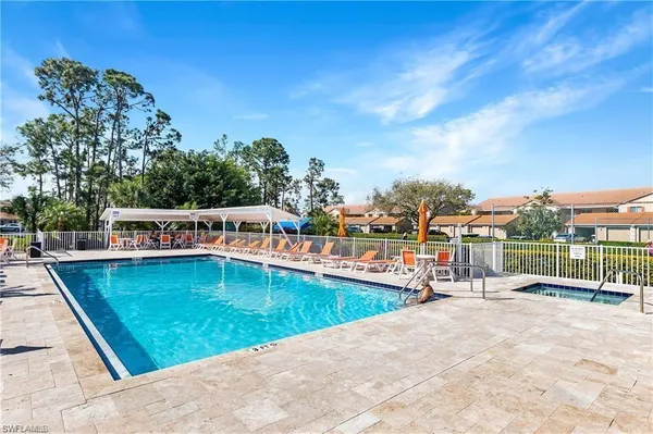 a view of swimming pool with seating space