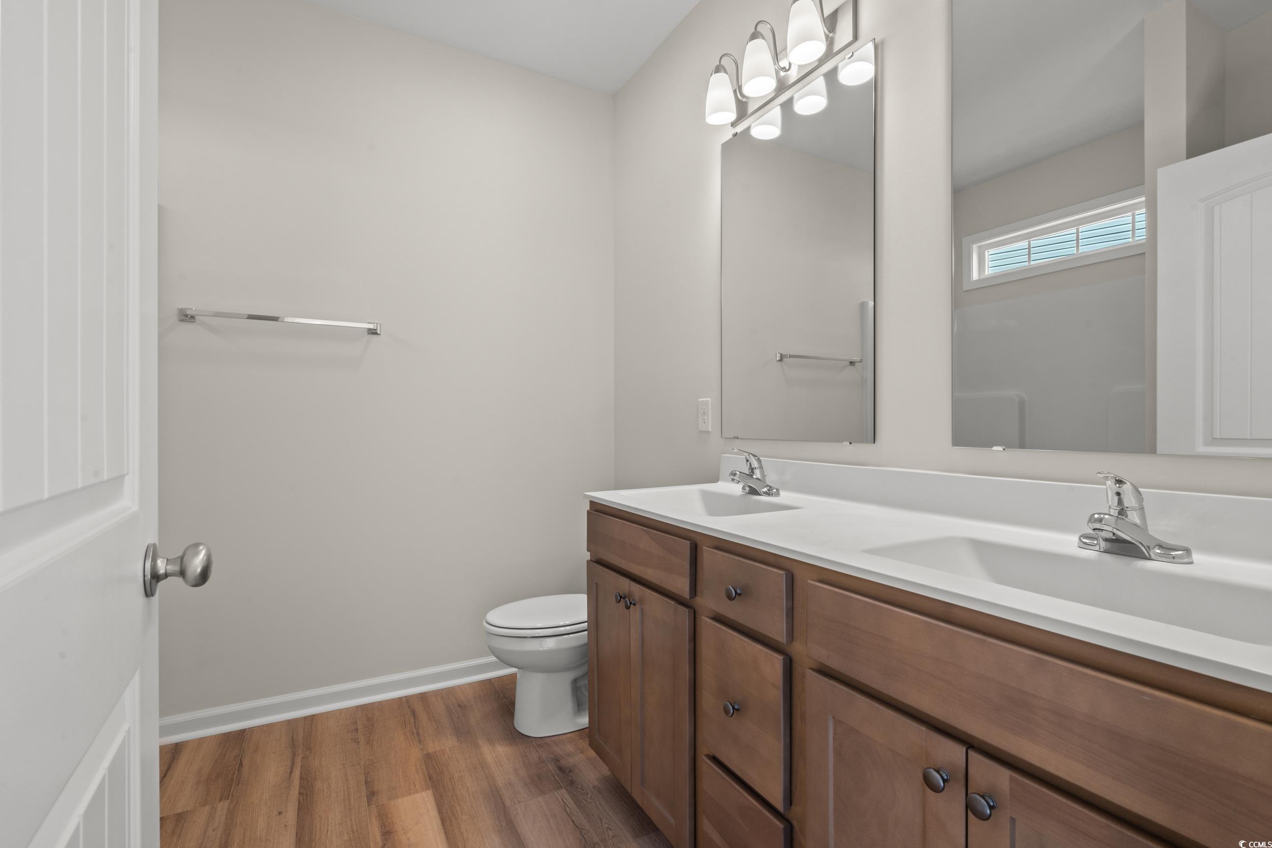 247 Stillbrook Drive Longs, SC 29568 - Photo 12 of 36 Full bathroom featuring dark wood-style floors and double vanity