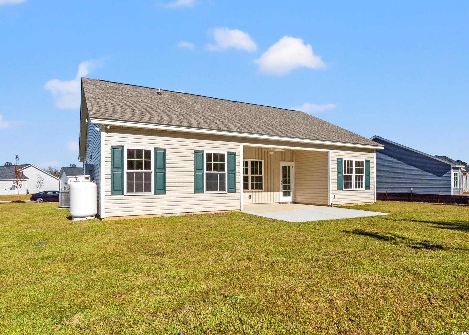 247 Stillbrook Drive Longs, SC 29568 - Photo 36 of 36 Rear view of house featuring a patio area, a shingled roof, and a ceiling fan