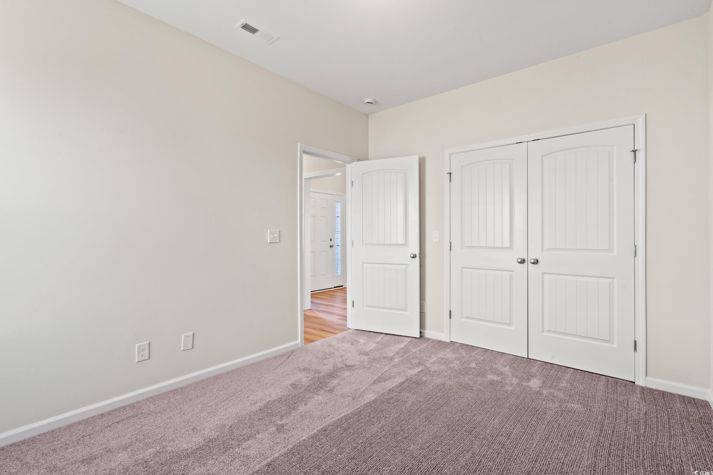 247 Stillbrook Drive Longs, SC 29568 - Photo 7 of 36 Unfurnished bedroom featuring carpet flooring and a closet