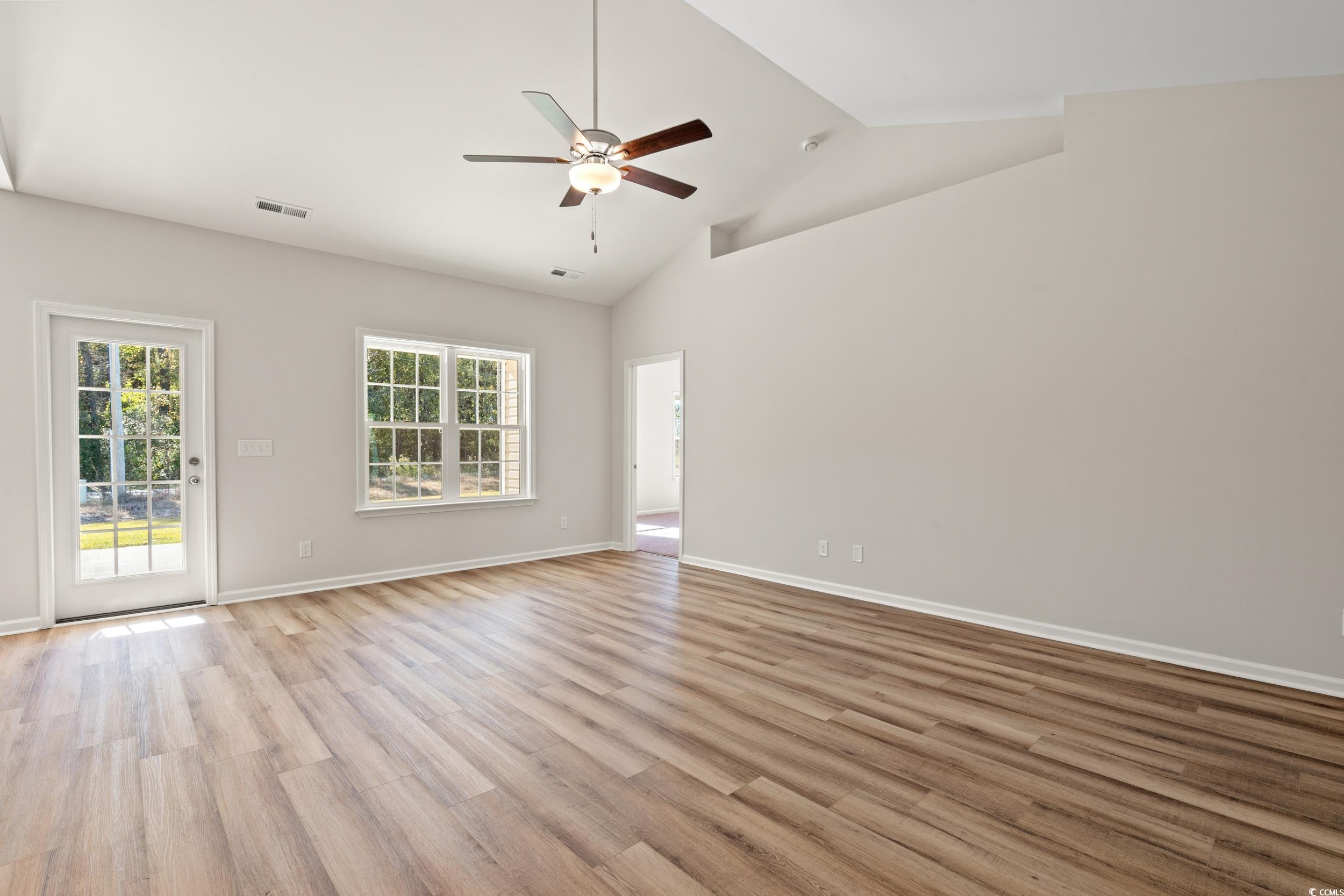 247 Stillbrook Drive Longs, SC 29568 - Photo 9 of 36 Unfurnished room with light wood-style flooring, high vaulted ceiling, and ceiling fan