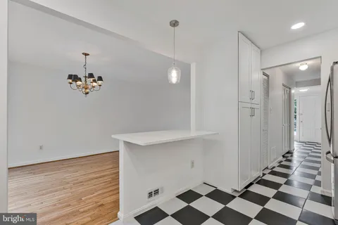 a view of a hallway with a chandelier