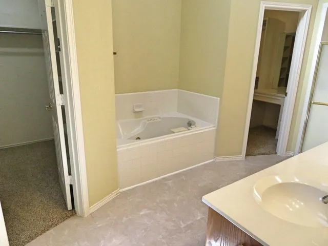 a bathroom with a sink and a tub