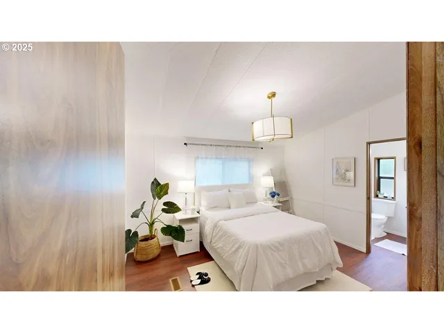 a living room with couches and chandelier