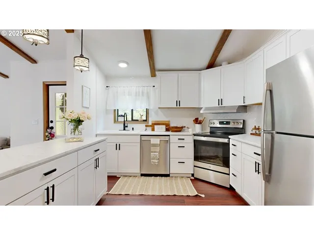 a kitchen with sink and cabinets