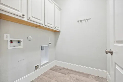 a view of a storage & utility room with closet