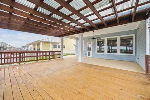 a view of a house with wooden deck