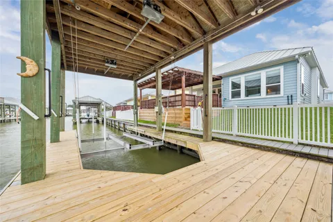 a view of swimming pool with seating area