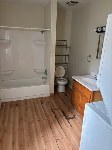 a bathroom with a sink and a shower