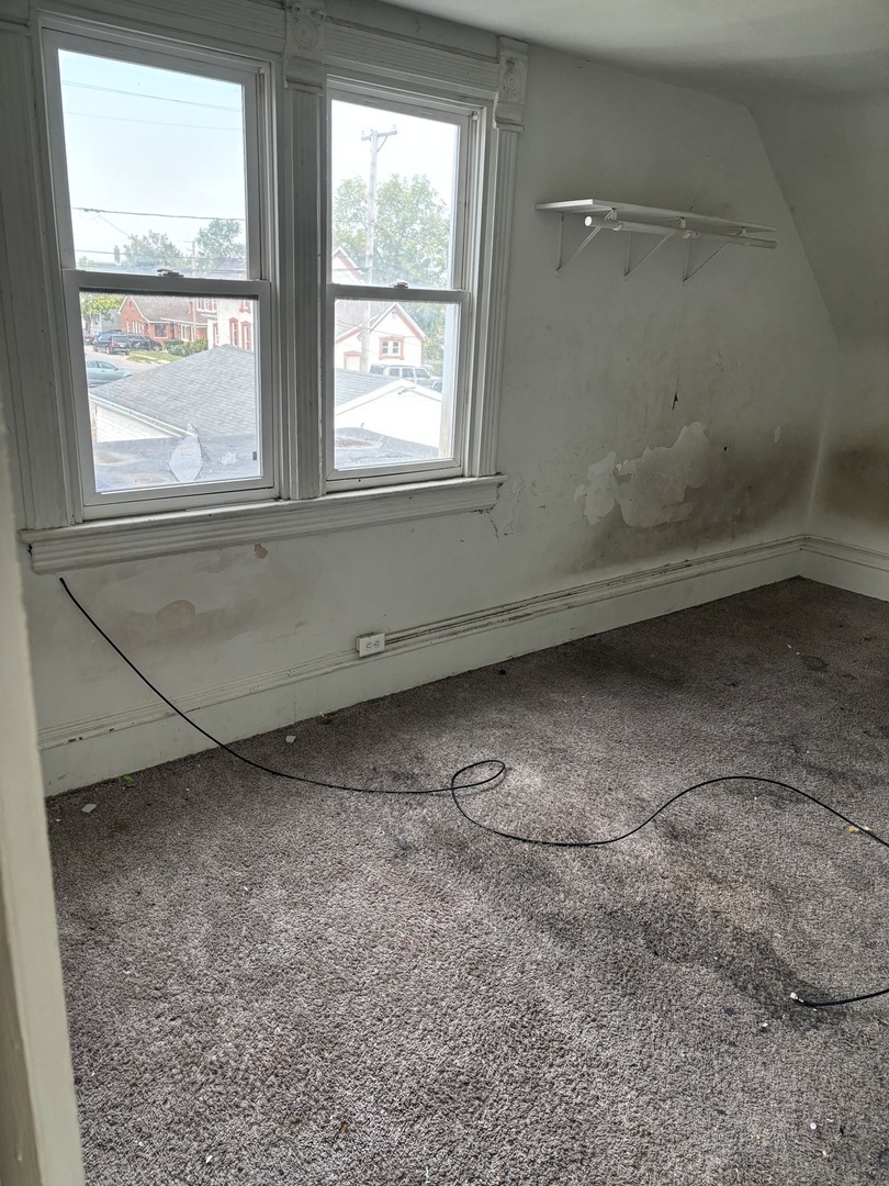 411 Leach Avenue Joliet, IL 60432 - Photo 7 of 8 a view of a room with an empty space