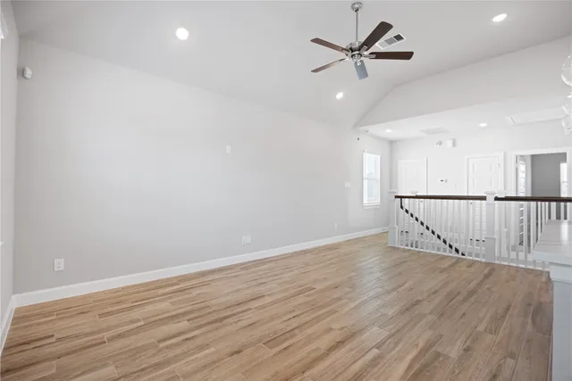 a kitchen with stainless steel appliances a stove top oven a sink and a refrigerator