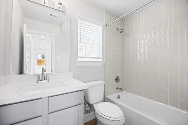 a view of kitchen with stainless steel appliances refrigerator stove and wooden floor