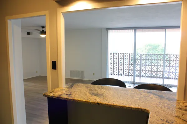 a kitchen with a sink and breakfast area