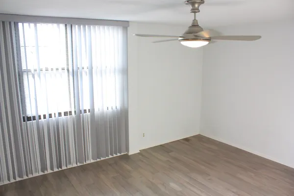a living room with stainless steel appliances kitchen island granite countertop furniture and a view of kitchen