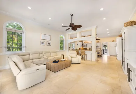 a dining room with stainless steel appliances kitchen island granite countertop a table and chairs
