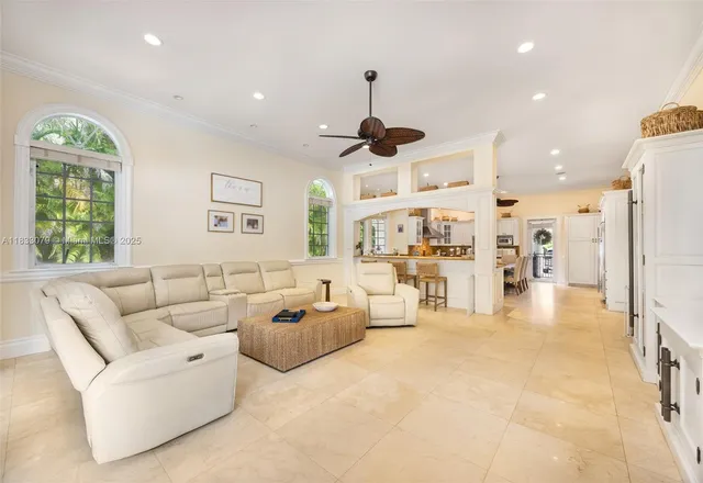 a dining room with stainless steel appliances kitchen island granite countertop a table and chairs