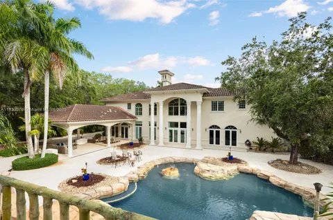 a view of swimming pool with a lounge chair