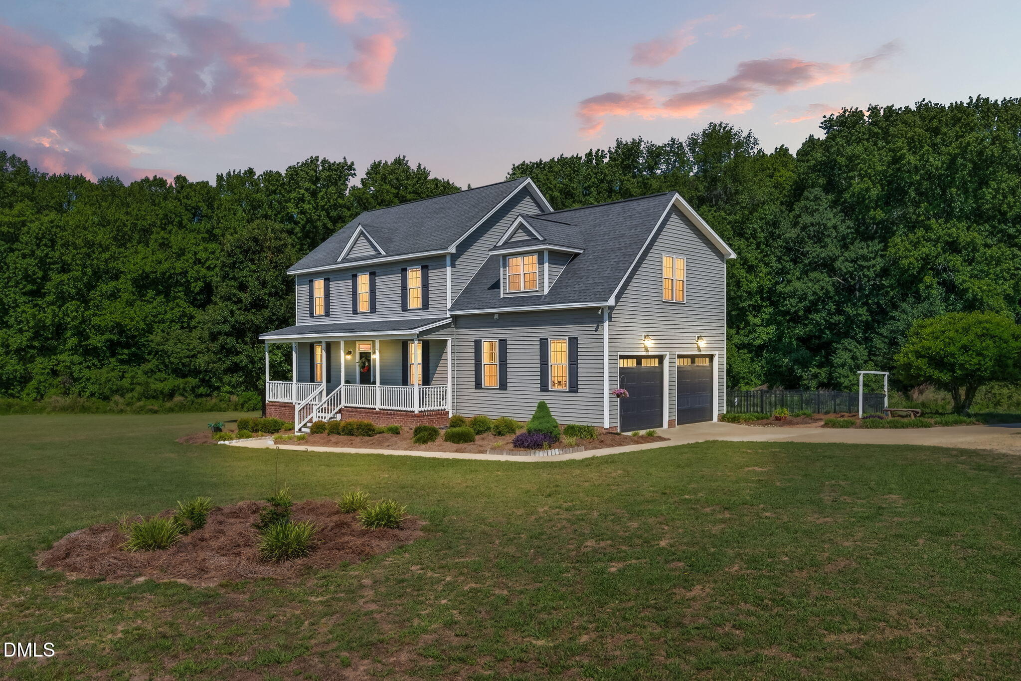 923 White Memorial Church Road Willow Spring, NC 27592 - Photo 1 of 46 a front view of a house with a yard table and chairs
