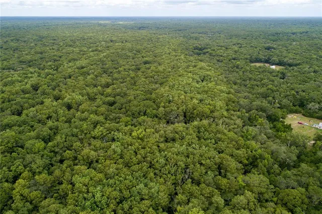 a view of a field with an outdoor space