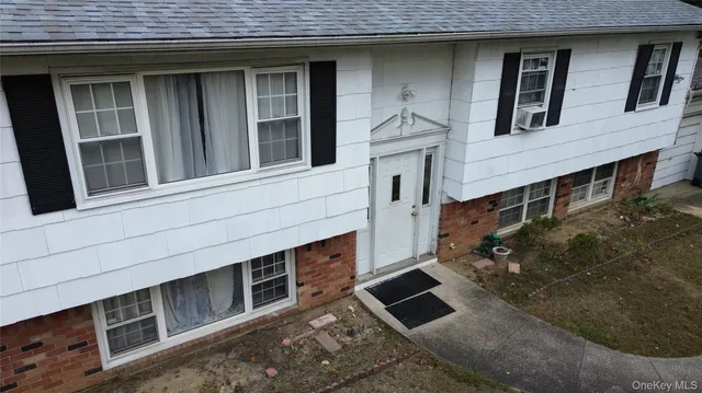a front view of a house with windows