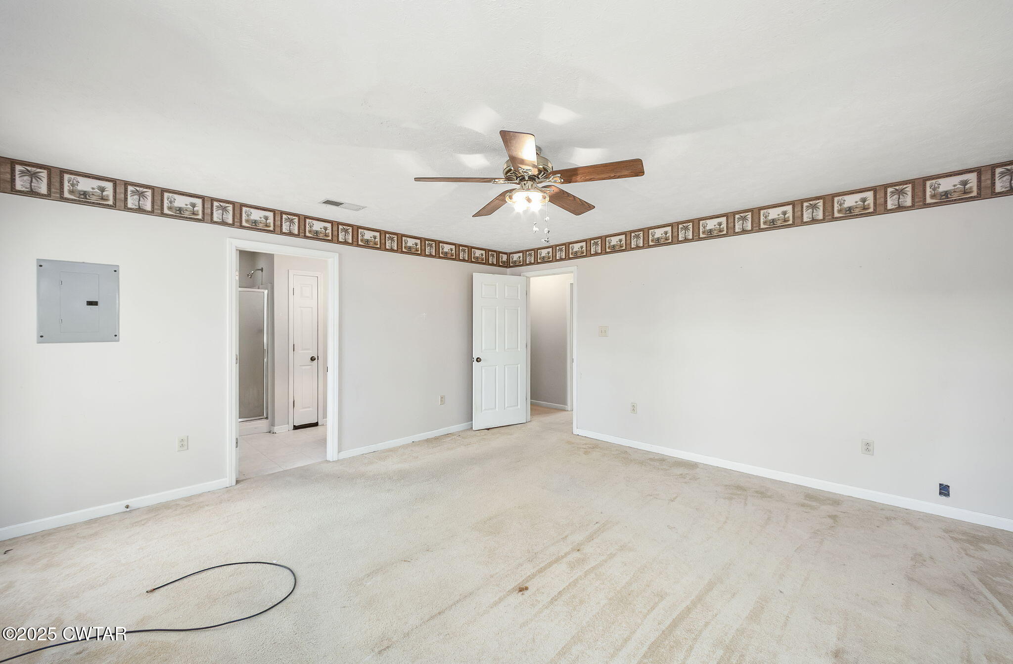 598 Old Bells Road Jackson, TN 38305 - Photo 19 of 40 a view of a room with wooden floor and white walls