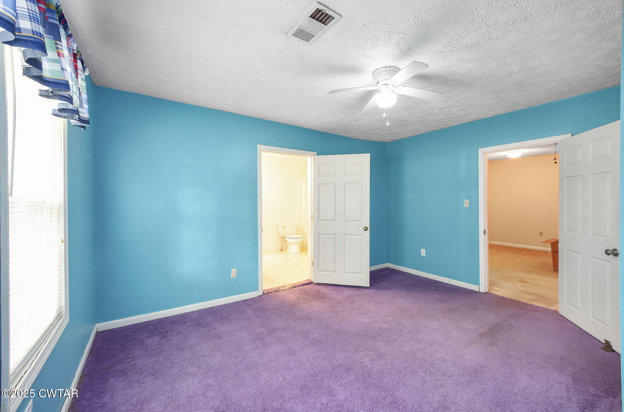 598 Old Bells Road Jackson, TN 38305 - Photo 25 of 40 an empty room with closet and a chandelier fan