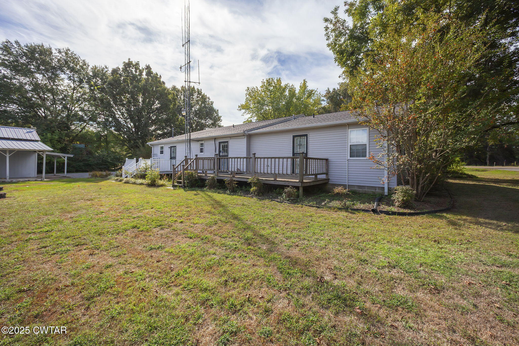 598 Old Bells Road Jackson, TN 38305 - Photo 27 of 40 a view of a house with a yard and sitting area