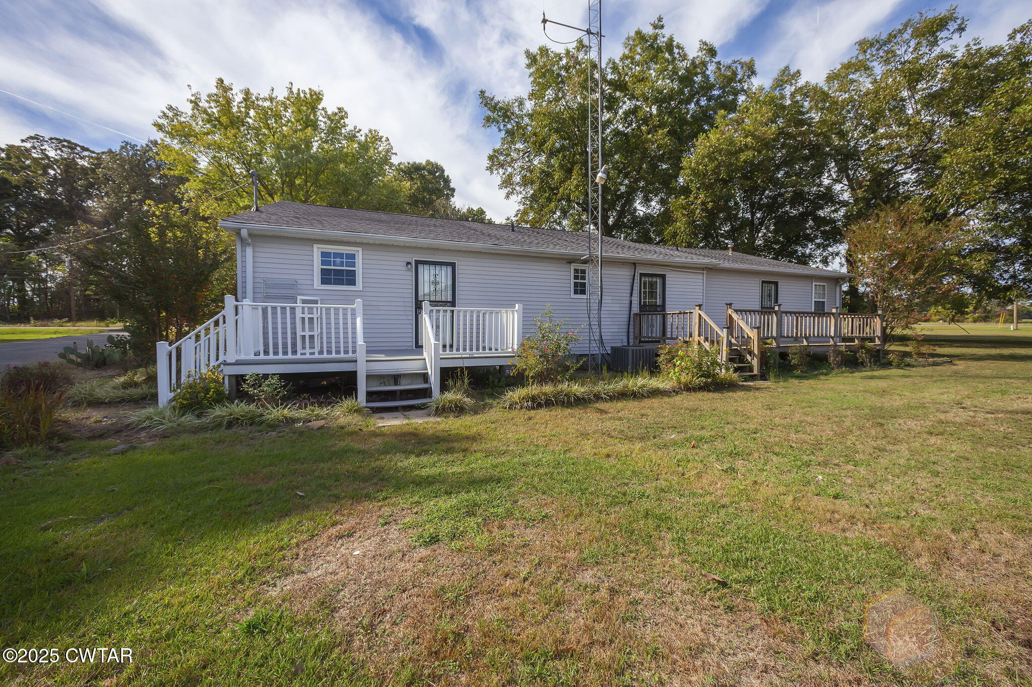 598 Old Bells Road Jackson, TN 38305 - Photo 28 of 40 a view of a house with a yard and sitting area