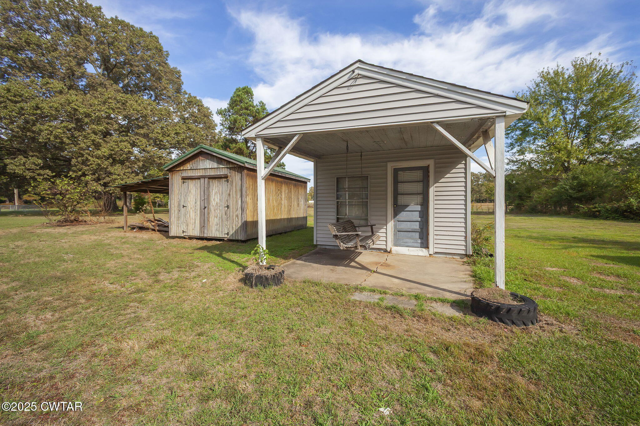 598 Old Bells Road Jackson, TN 38305 - Photo 30 of 40 a view of a house with backyard and garden