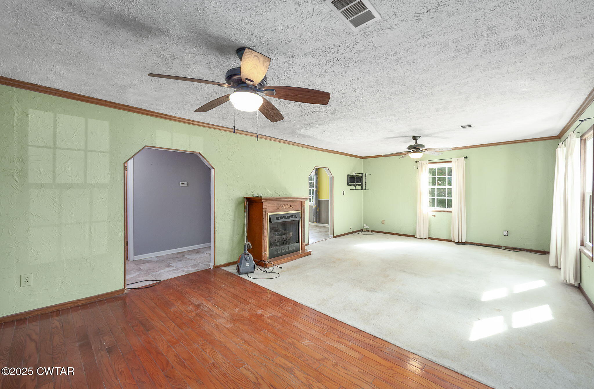 598 Old Bells Road Jackson, TN 38305 - Photo 4 of 40 a view of an empty room with a fireplace