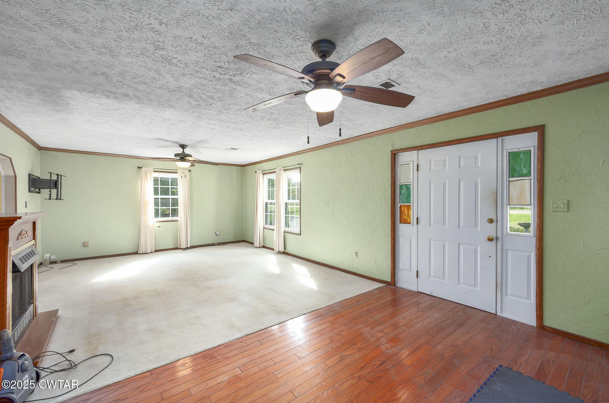 598 Old Bells Road Jackson, TN 38305 - Photo 7 of 40 a view of an empty room with window and wooden floor