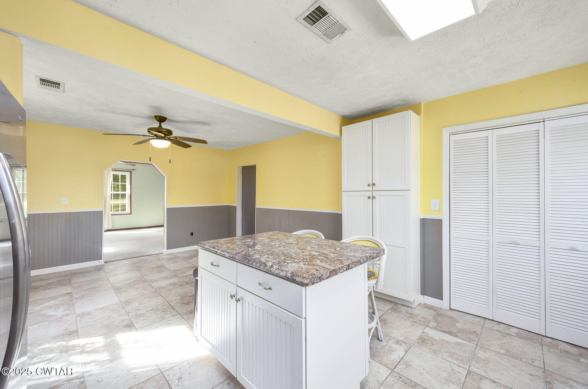 598 Old Bells Road Jackson, TN 38305 - Photo 10 of 40 a kitchen with a sink cabinets and wooden floor