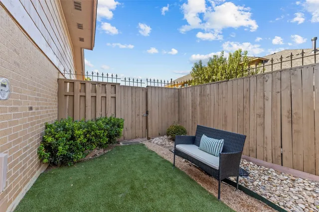 a view of outdoor space with garden and furniture