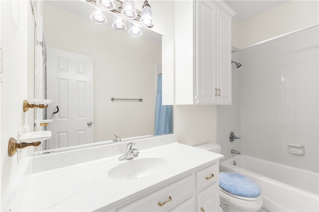 2120 Hohenwalde School Road Brenham, TX 77833 - Photo 19 of 30 a bathroom with a sink a toilet and a mirror