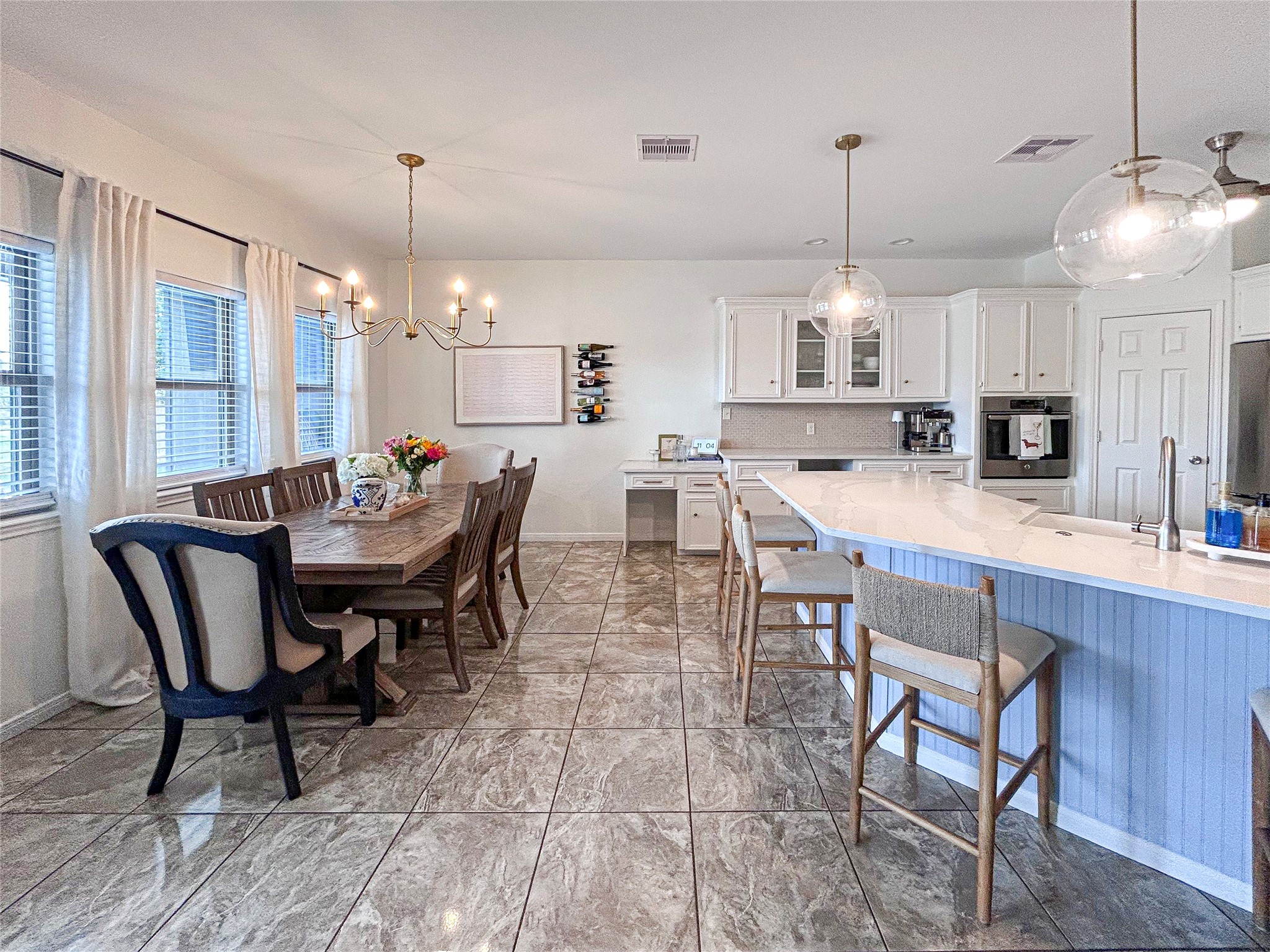 626 Sunset Trail Angleton, TX 77515 - Photo 13 of 43 a large kitchen with a table and chairs