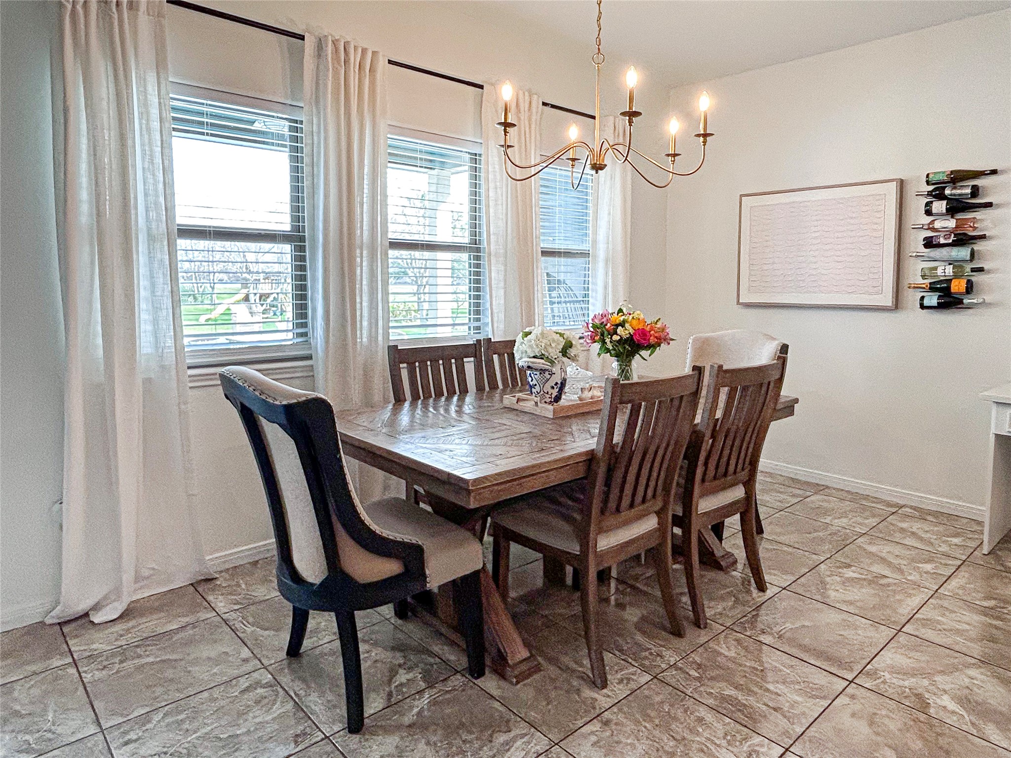 626 Sunset Trail Angleton, TX 77515 - Photo 14 of 43 a view of a dining room with furniture and a chandelier